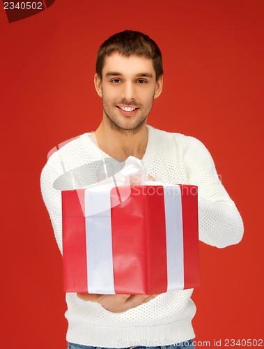 Image of handsome man with a gift