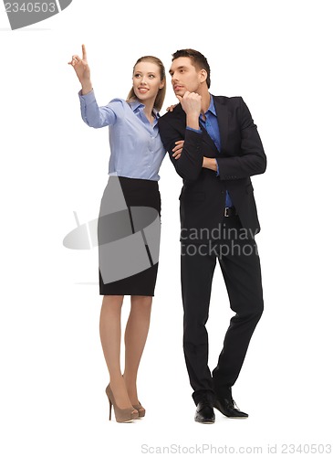 Image of man and woman working with something imaginary