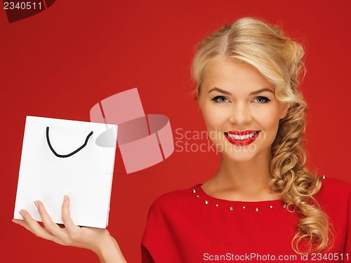 Image of lovely woman in red dress with shopping bag