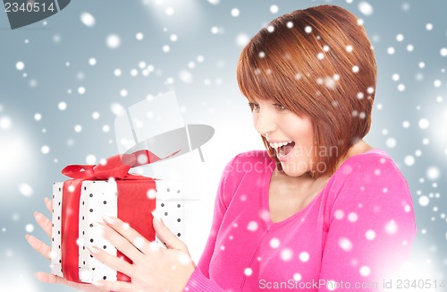 Image of happy woman with gift box