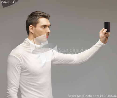 Image of man with access card