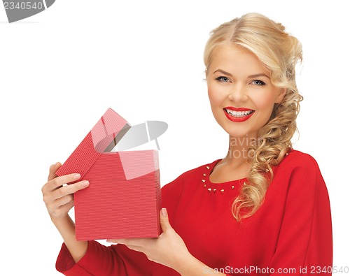 Image of lovely woman in red dress with opened gift box