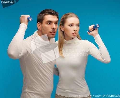 Image of man and woman with pocket flashlights