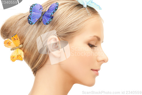 Image of woman with butterfly in hair