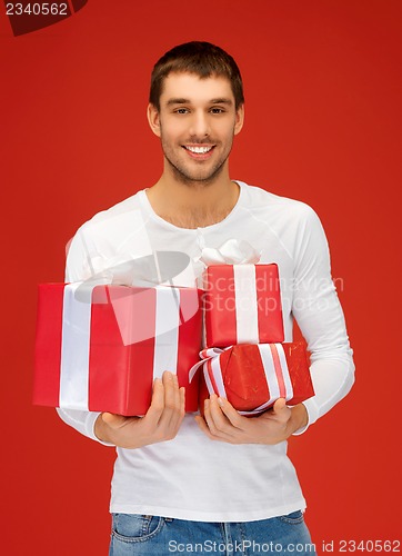 Image of man holding many gift boxes