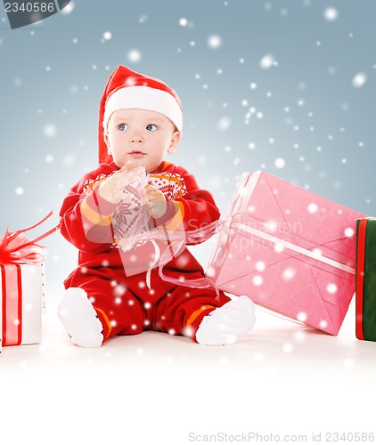 Image of santa helper baby with christmas gifts