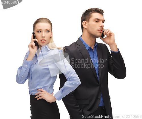 Image of man and woman with cell phones