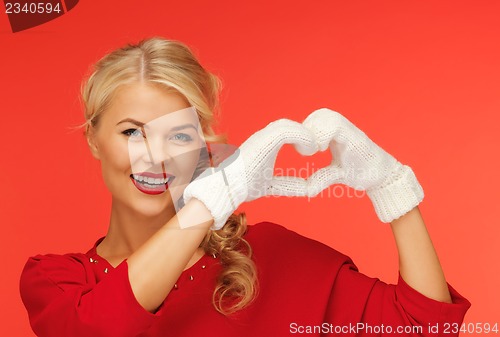 Image of lovely woman showing heart shape