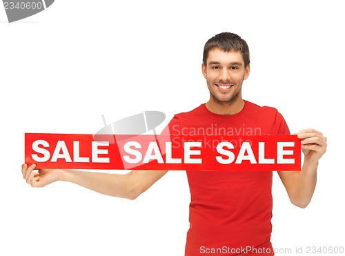 Image of handsome man with sale sign