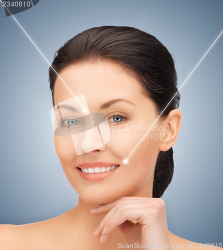 Image of face and hands of beautiful woman