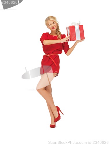 Image of lovely woman in red dress with present
