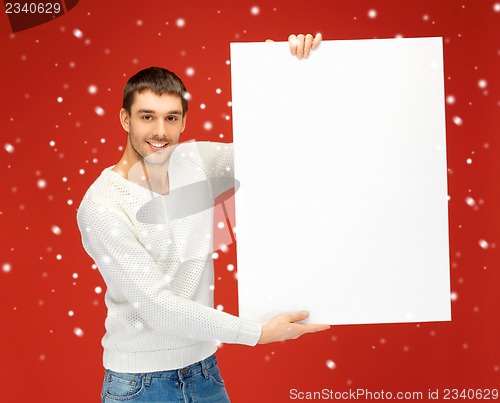 Image of handsome man with big blank board