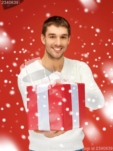 Image of handsome man with a gift