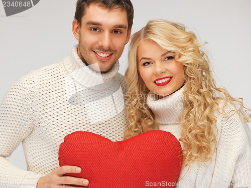 Image of family couple in a sweaters with heart