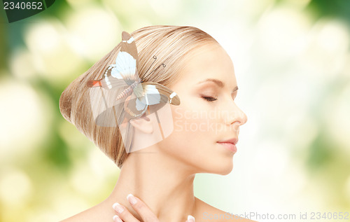 Image of woman with butterflies in hair