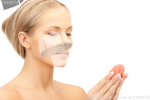 Image of beautiful woman with seashell