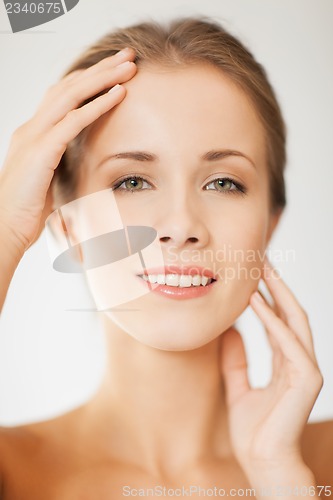 Image of face and hands of beautiful woman