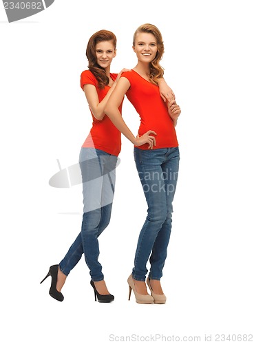 Image of two beautiful teenage girls in red t-shirts