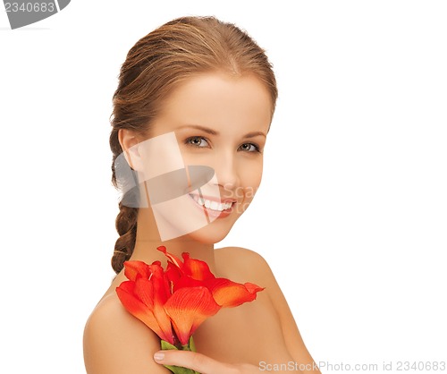 Image of lovely woman with red lily flower