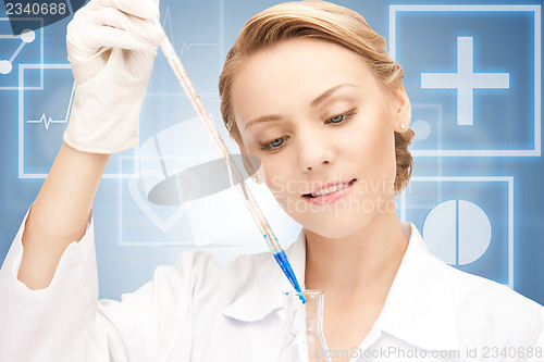 Image of lab worker holding up test tube