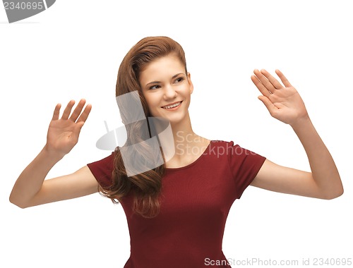 Image of girl in red dress working with something imaginary