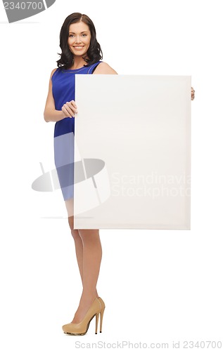 Image of lovely woman in blue dress with blank board