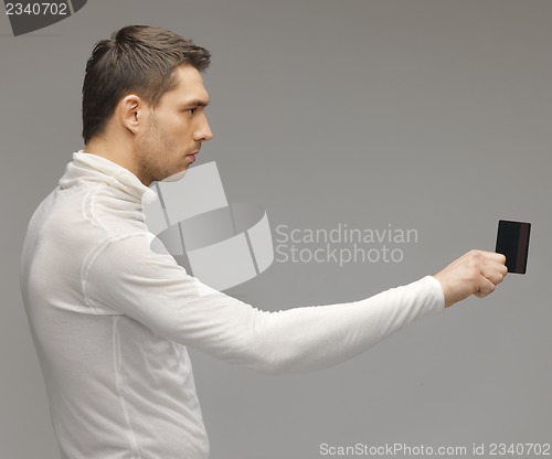 Image of man with access card