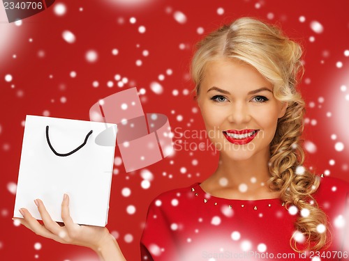 Image of lovely woman in red dress with shopping bag