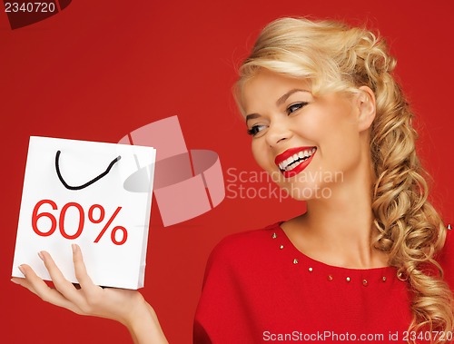 Image of lovely woman in red dress with shopping bag