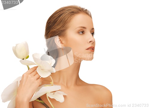 Image of lovely woman with orchid flower