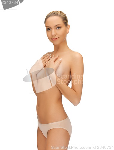 Image of beautiful topless woman in panties