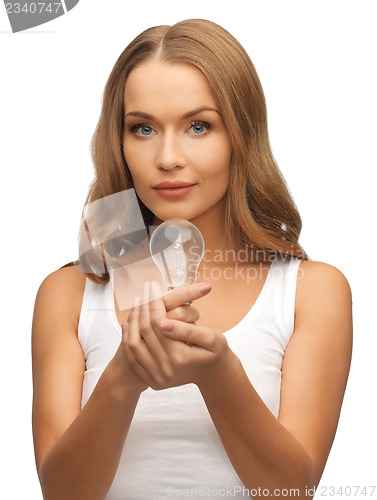 Image of woman with energy saving bulb