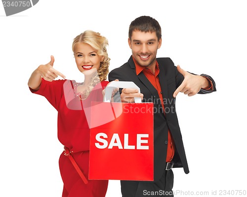 Image of man and woman with shopping bag