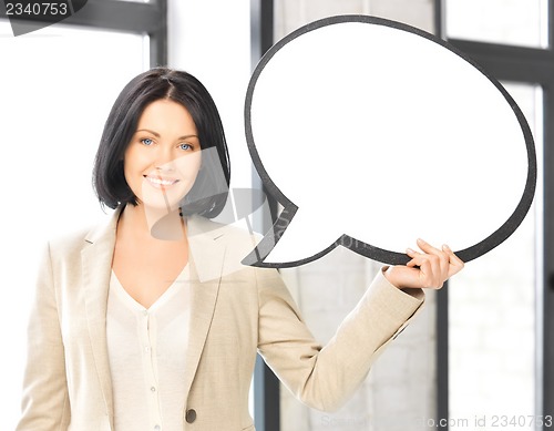 Image of smiling businesswoman with blank text bubble