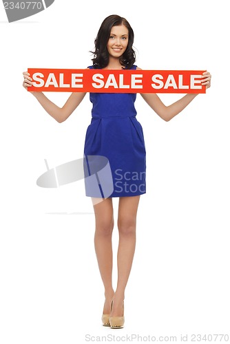 Image of lovely woman in blue dress with sale sign