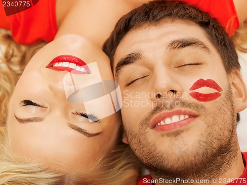 Image of happy couple lying at home with closed eyes