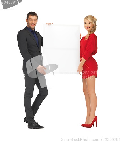 Image of couple holding big blank board