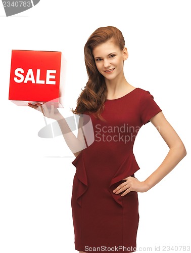 Image of teenage girl in red dress with sale sign