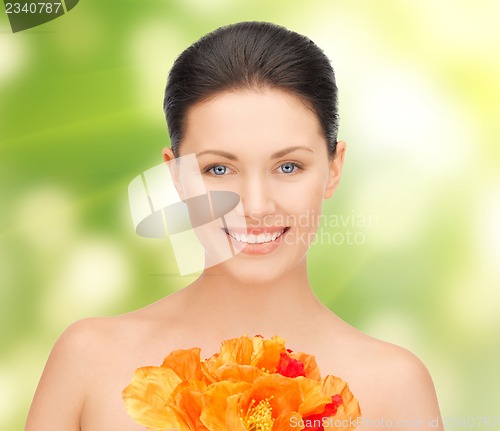 Image of woman with red flowers
