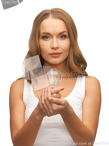 Image of woman with energy saving bulb