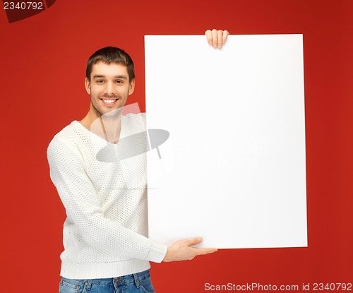 Image of handsome man with big blank board