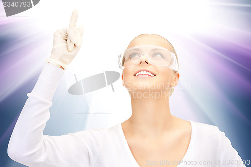 Image of woman in protective glasses and gloves