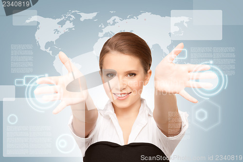 Image of businesswoman working with touch screen