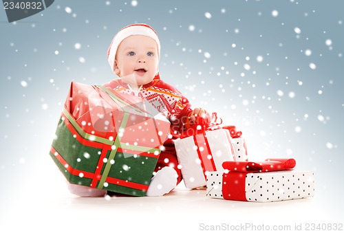 Image of santa helper baby with christmas gifts