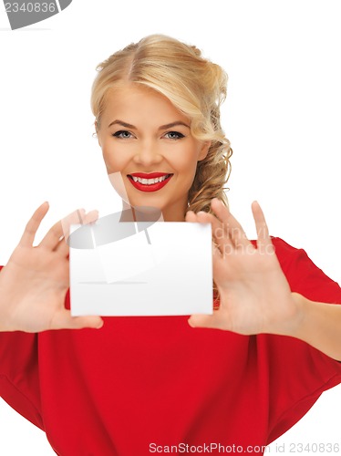 Image of lovely woman in red dress with note card