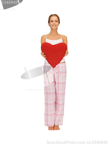 Image of woman in cotton pajamas with big heart