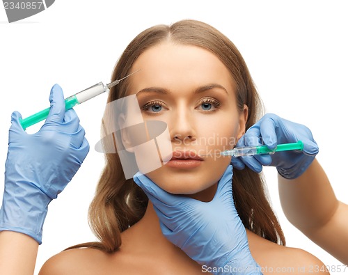 Image of woman face and beautician hands