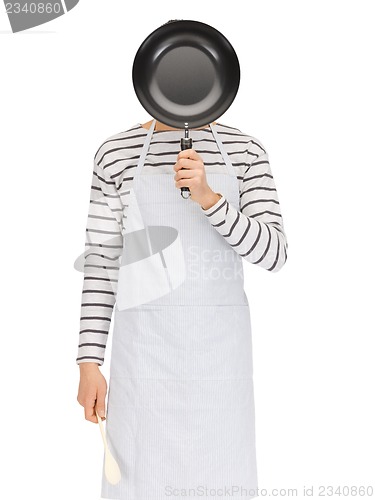 Image of man with pan and spoon