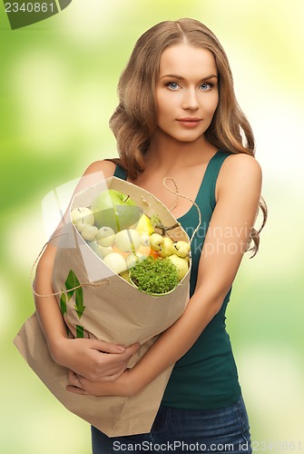 Image of woman with shopping bag full of fruits