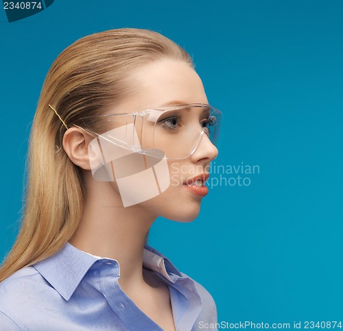Image of businesswoman in protective glasses
